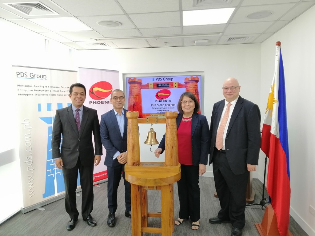 In the photo from left are: PNB Capital President & Chief Executive Officer Gerry Valenciano, Phoenix Petroleum Philippines, Inc. (PNX) Assistant Vice President - Treasury Reynaldo Phala,  PNX Chief Financial Officer Ma. Concepcion de Claro, and Philippine Dealing & Exchange Corp. President & Chief Operating Officer Antonino Nakpil.  